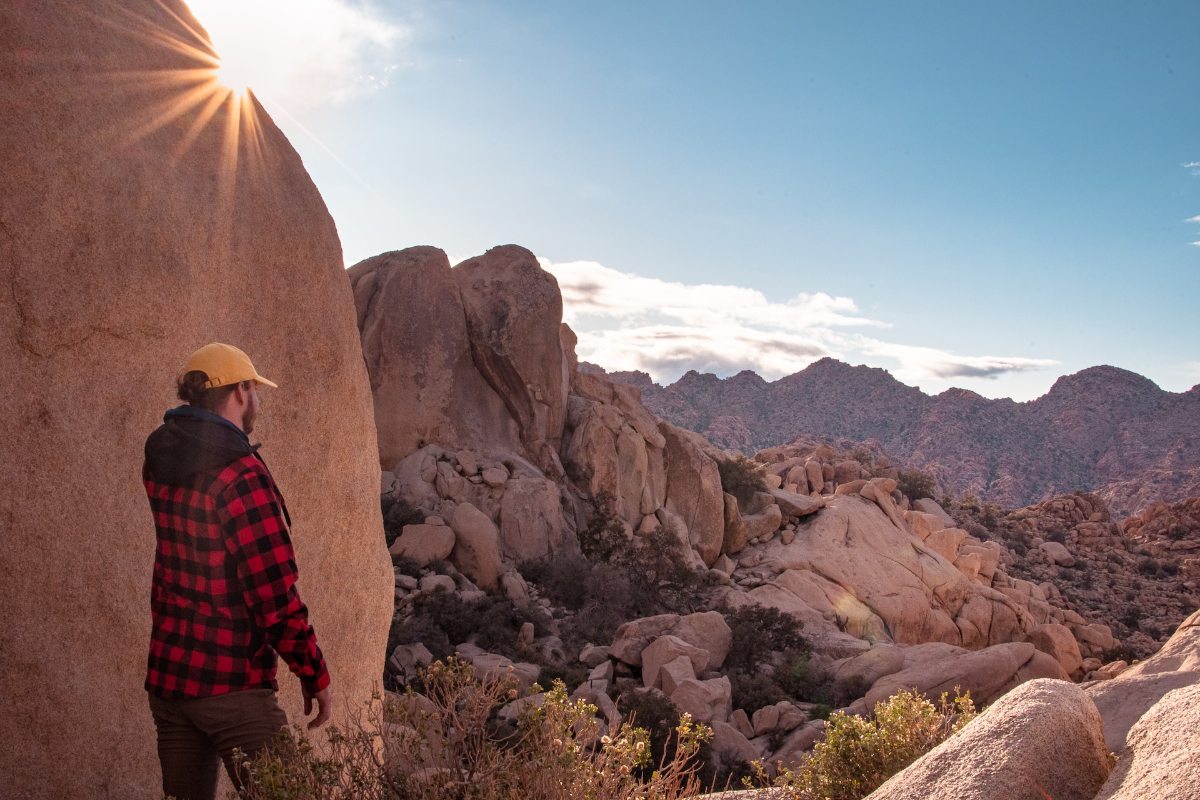 Hiker enjoying view of Real Hidden Valley in Joshua Tree